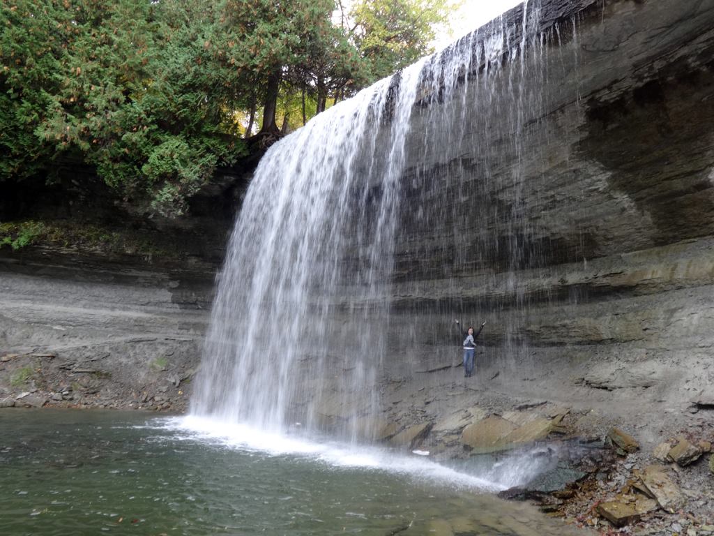 Standing behind bridal veil falls